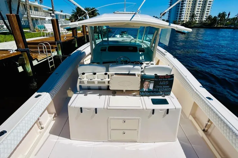 The Office Yacht Photos Pics 2012 Grady-White Canyon 366 boat docked by waterfront homes.