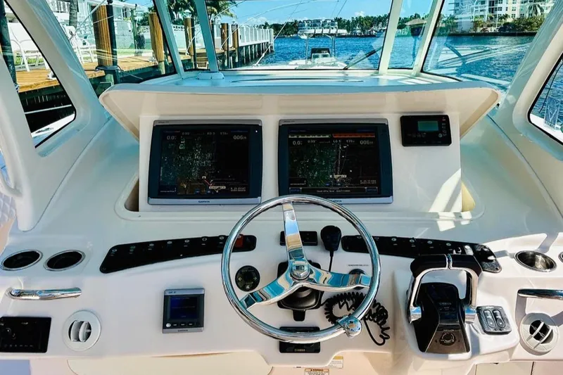 The Office Yacht Photos Pics Grady-White Canyon 366 2012 boat helm with dual navigation screens and controls.