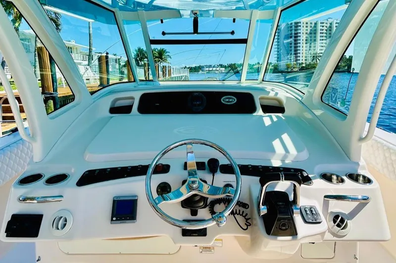 The Office Yacht Photos Pics 2012 Grady-White Canyon 366 helm with modern controls and waterfront view.
