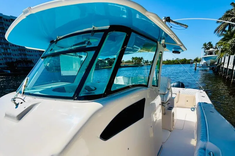 The Office Yacht Photos Pics 2012 Grady-White Canyon 366 boat on a sunny waterfront.