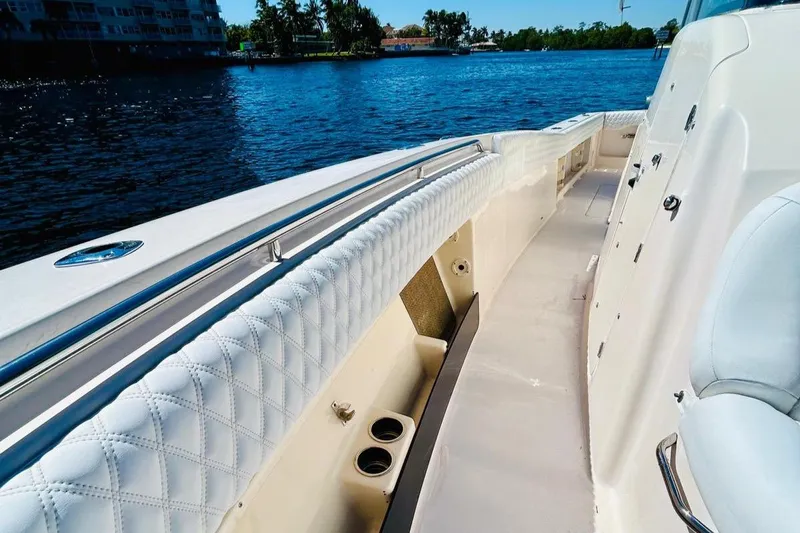 The Office Yacht Photos Pics 2012 Grady-White Canyon 366 boat interior with white upholstery, on a sunny day by the water.