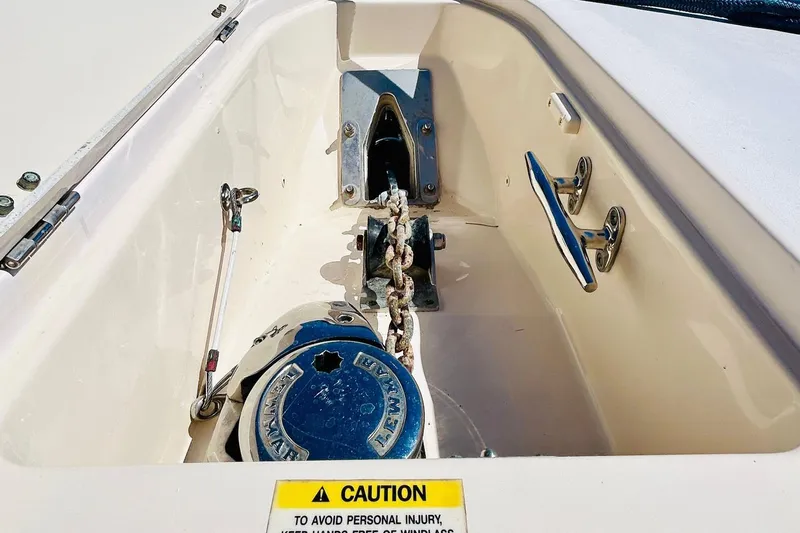 The Office Yacht Photos Pics Anchor compartment of 2012 Grady-White Canyon 366 boat with caution label.