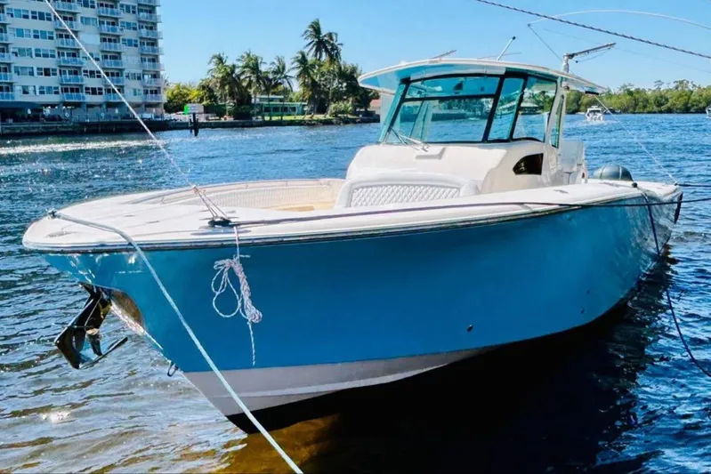 The Office Yacht Photos Pics 2012 Grady-White Canyon 366 boat docked on a sunny day.