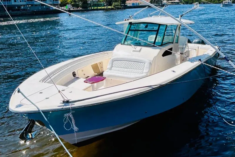The Office Yacht Photos Pics 2012 Grady-White Canyon 366 boat on water, front view.