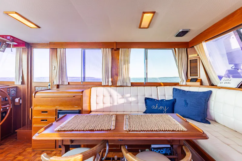 Cheers Yacht Photos Pics Interior of 1989 Grand Banks 46 Classic yacht with wooden furnishings and nautical decor.