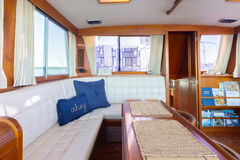 Cheers Yacht Photos Pics Interior of 1989 Grand Banks 46 Classic yacht with cozy seating and nautical decor.