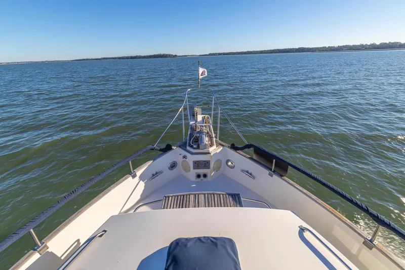 Cheers Yacht Photos Pics Bow view of 1989 Grand Banks 46 Classic yacht on open water.