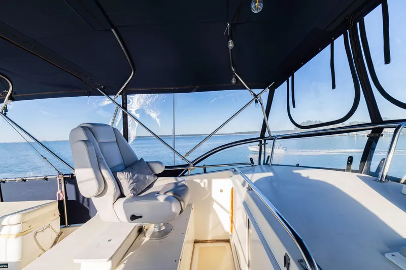 Cheers Yacht Photos Pics 1989 Grand Banks 46 Classic yacht helm with ocean view and comfortable seating.