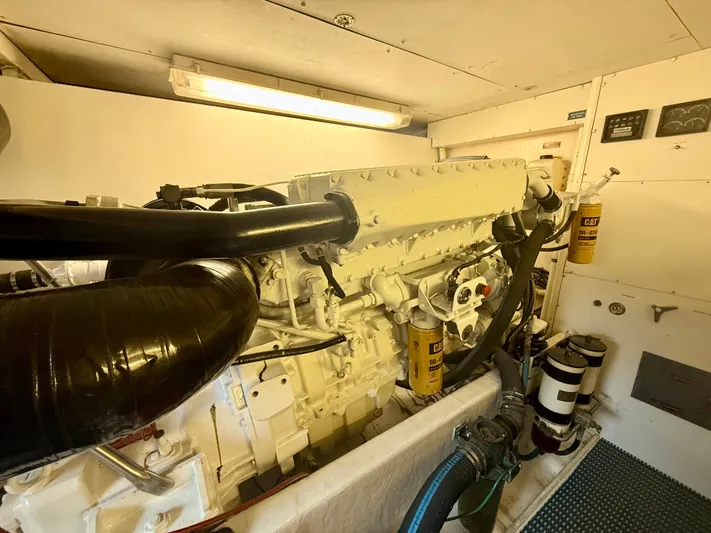 Cavileah Yacht Photos Pics Engine room of 1997 West Bay Sonship 58 Pilothouse with visible machinery and components.