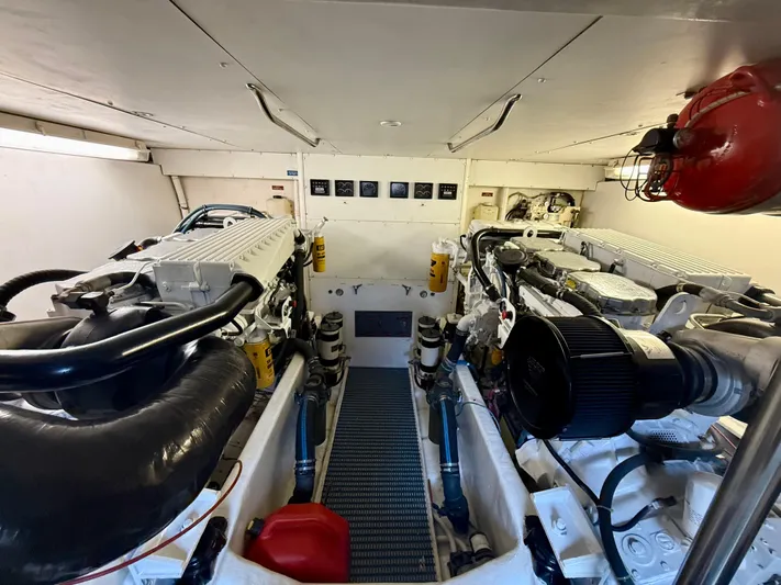 Cavileah Yacht Photos Pics Engine room of 1997 West Bay Sonship 58 Pilothouse yacht, featuring dual engines and equipment.
