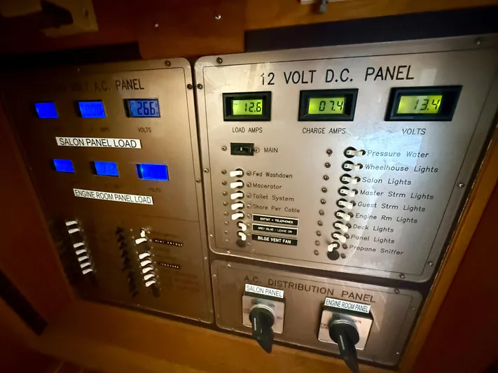 Cavileah Yacht Photos Pics Electrical control panel of 1997 West Bay Sonship 58 Pilothouse yacht, showing voltage and load indicators.