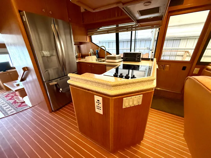Cavileah Yacht Photos Pics Luxurious kitchen interior of 1997 West Bay Sonship 58 Pilothouse yacht with modern appliances.