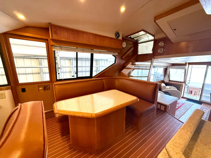 Cavileah Yacht Photos Pics Luxurious 1997 West Bay Sonship 58 Pilothouse interior with elegant wood finishes and spacious seating.
