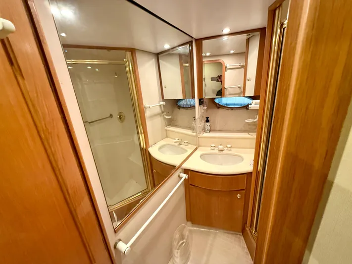 Cavileah Yacht Photos Pics Luxurious bathroom in 1997 West Bay Sonship 58 Pilothouse yacht with dual sinks and shower.