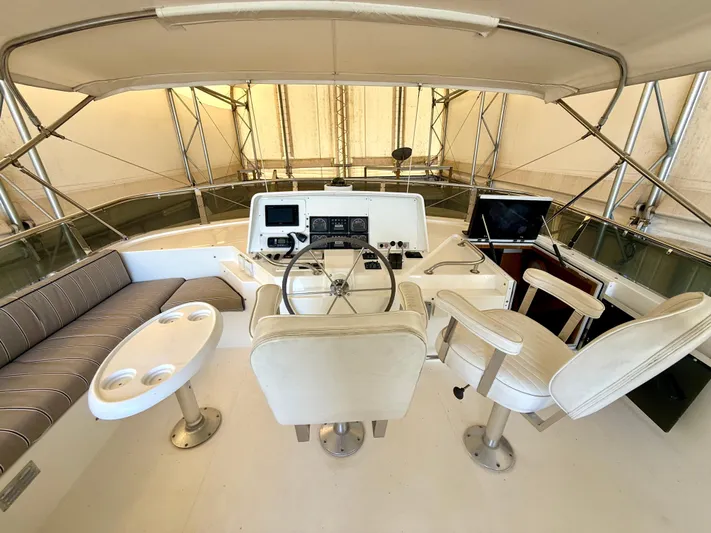 Cavileah Yacht Photos Pics 1997 West Bay Sonship 58 Pilothouse interior with helm, seating, and navigation equipment.