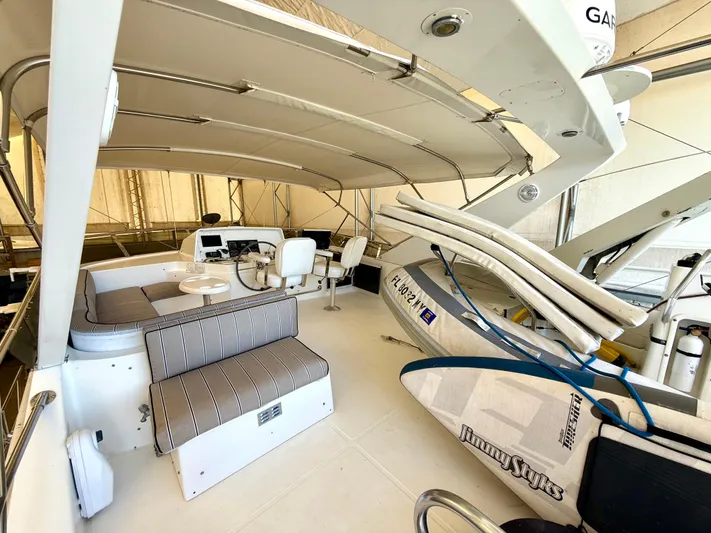 Cavileah Yacht Photos Pics 1997 West Bay Sonship 58 Pilothouse interior with seating and navigation equipment.