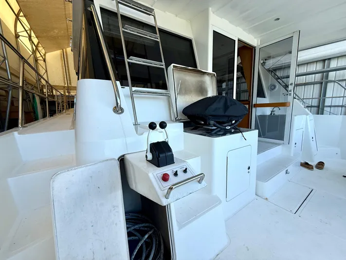 Cavileah Yacht Photos Pics 1997 West Bay Sonship 58 Pilothouse yacht deck with controls and seating area.