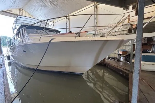 Cavileah Yacht Photos Pics 1997 West Bay Sonship 58 Pilothouse yacht docked in a covered marina.