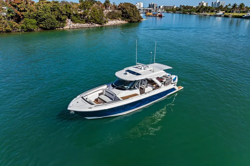 Miss Marie Yacht Photos Pics 2019 Tiara Yachts 38 LS cruising on a serene, blue waterway.