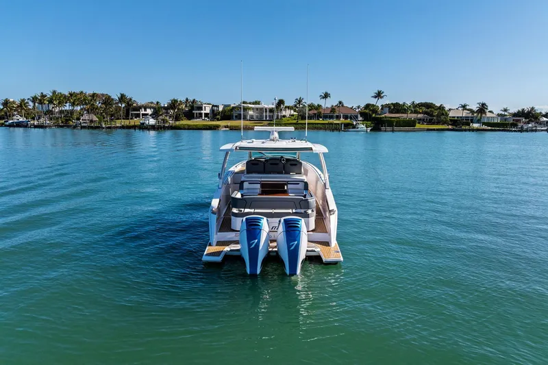 Miss Marie Yacht Photos Pics 2019 Tiara Yachts 38 LS on serene water with scenic coastal backdrop.