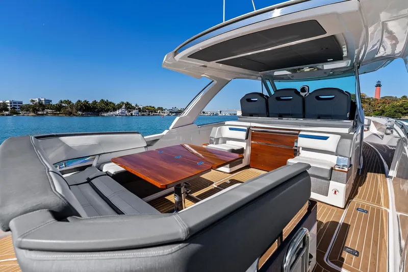 Miss Marie Yacht Photos Pics 2019 Tiara Yachts 38 LS luxury yacht interior with seating and table, ocean view.