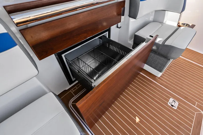 Miss Marie Yacht Photos Pics 2019 Tiara Yachts 38 LS interior with open storage compartment and seating.
