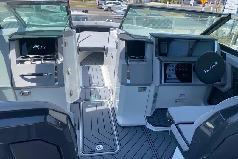 Casa - 2023 Cobalt R33 Ob @ Vallarta Yacht Photos Pics 2023 Cobalt R33 Outboard boat interior with modern dashboard and seating.
