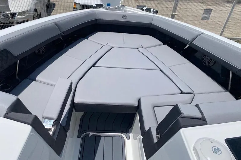 Casa - 2023 Cobalt R33 Ob @ Vallarta Yacht Photos Pics 2023 Cobalt R33 Outboard boat interior with gray cushioned seating.