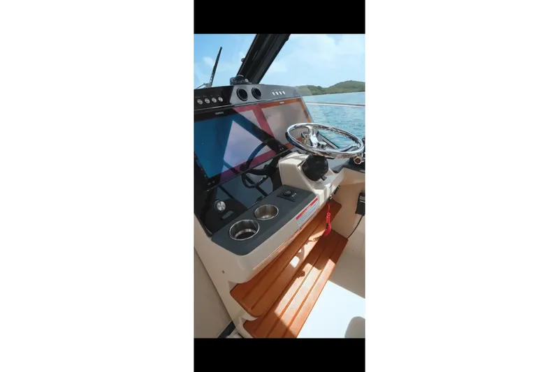  Yacht Photos Pics 2024 Boston Whaler 405 Conquest helm with modern controls and ocean view.