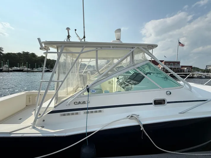 Club Car Yacht Photos Pics 1999 Cabo 31 Express boat docked at marina with clear skies.