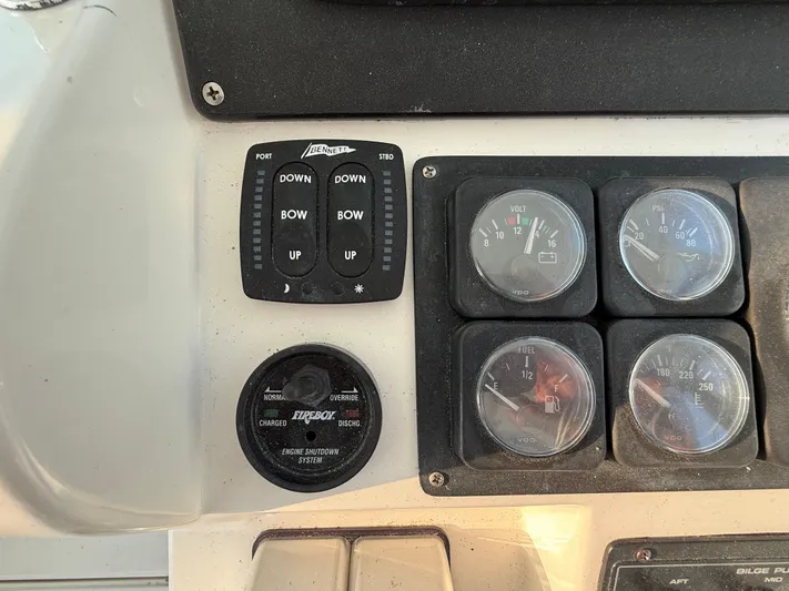 Club Car Yacht Photos Pics Control panel of a 1999 Cabo 31 Express boat with gauges and switches.