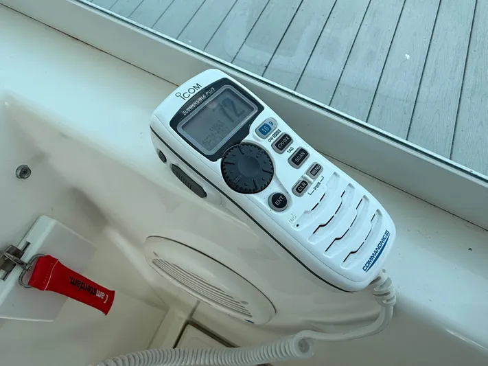 Club Car Yacht Photos Pics ICOM marine radio on a 1999 Cabo 31 Express boat dashboard.