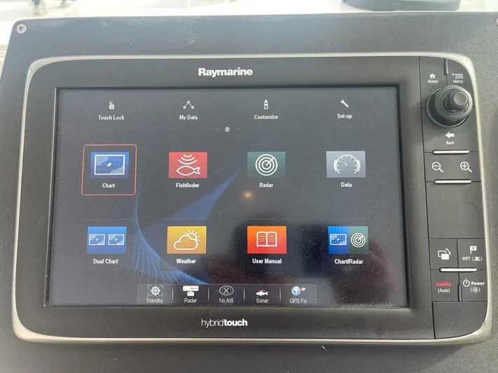 Club Car Yacht Photos Pics Raymarine hybridtouch display on 1999 Cabo 31 Express, showing navigation and weather options.