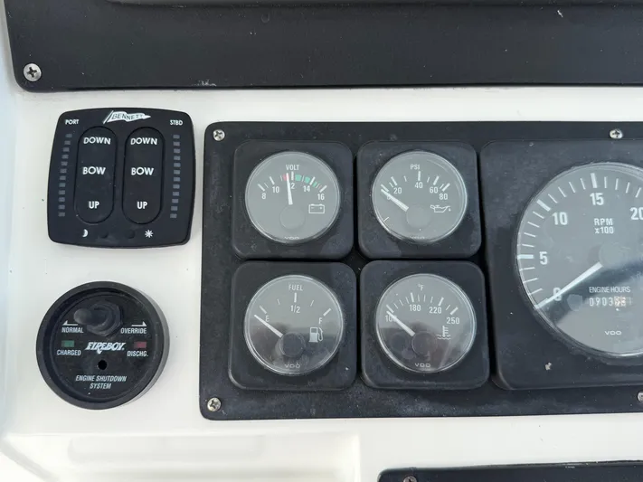 Club Car Yacht Photos Pics Control panel of a 1999 Cabo 31 Express boat with gauges and switches.