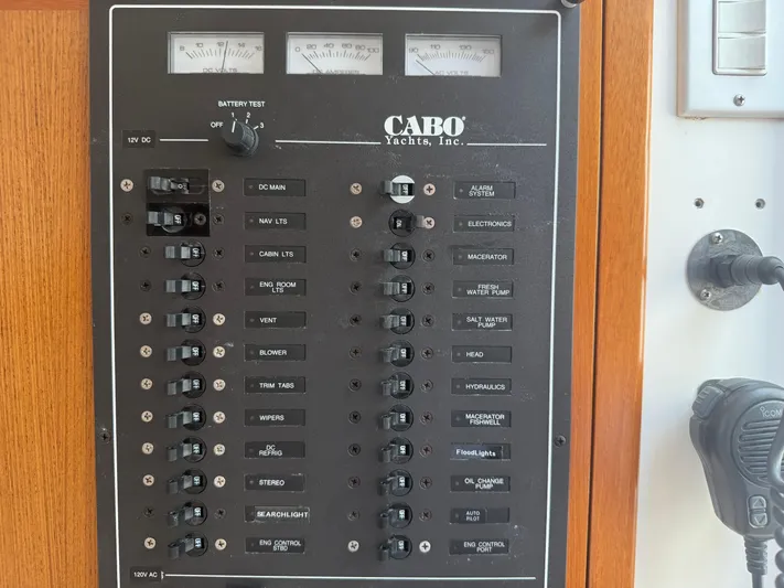 Club Car Yacht Photos Pics Control panel of a 1999 Cabo 31 Express yacht with various switches and gauges.