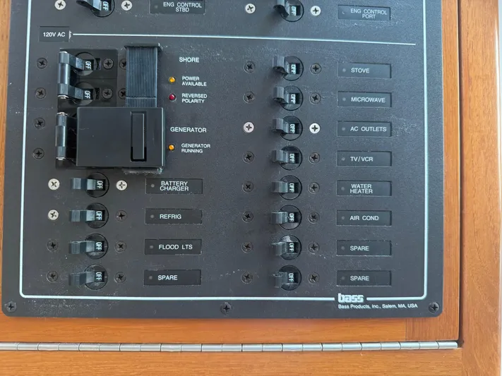 Club Car Yacht Photos Pics Electrical control panel on a 1999 Cabo 31 Express boat, featuring various switches and indicators.