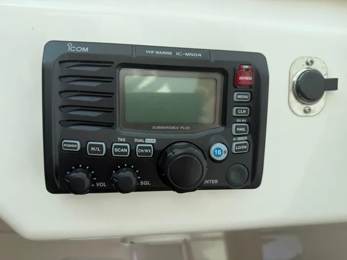 Club Car Yacht Photos Pics VHF marine radio IC-M504 on 1999 Cabo 31 Express boat dashboard.