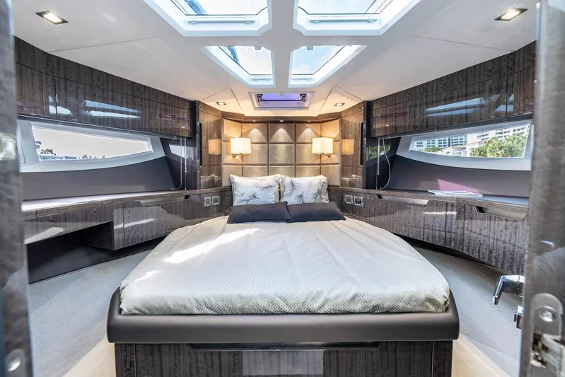  Yacht Photos Pics Luxurious bedroom interior of 2021 Galeon 500 Fly yacht with skylights and modern design.