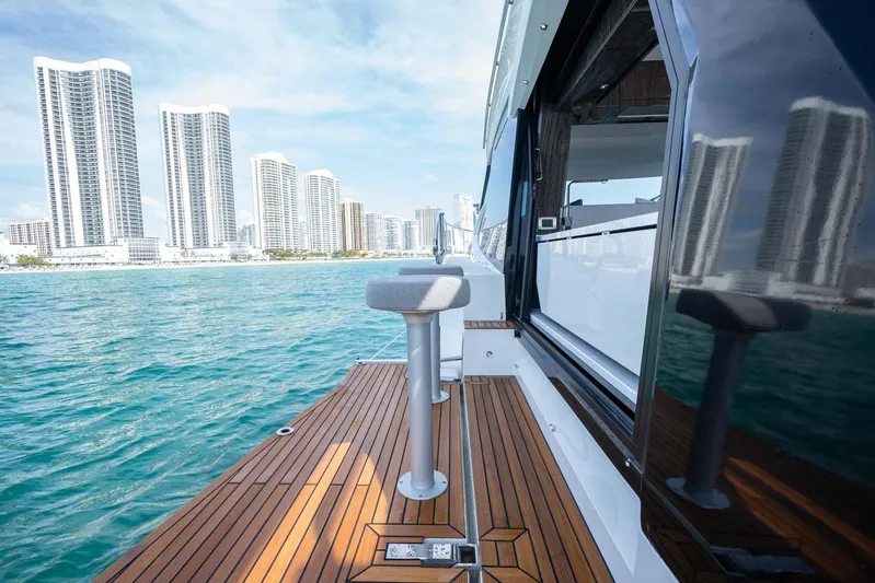  Yacht Photos Pics 2021 Galeon 500 Fly yacht with city skyline and ocean view.