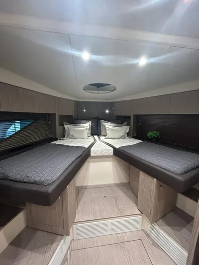  Yacht Photos Pics Luxurious cabin interior of 2024 Sessa Marine C44 Cruiser with twin beds and modern decor.