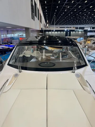  Yacht Photos Pics 2024 Sessa Marine C44 Cruiser at a boat show, showcasing sleek design and luxury features.