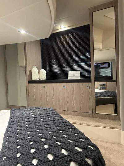  Yacht Photos Pics Luxurious interior of 2024 Sessa Marine C44 Cruiser with modern decor and cozy bedding.