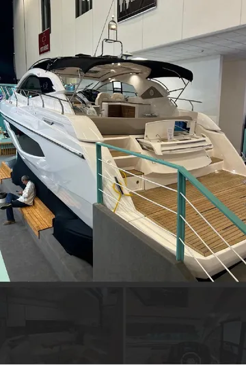  Yacht Photos Pics 2024 Sessa Marine C44 Cruiser displayed indoors, showcasing sleek design and modern features.