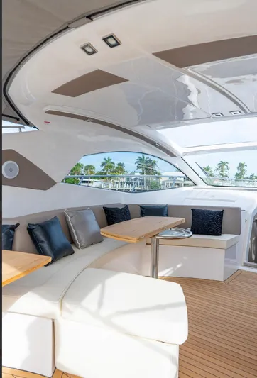  Yacht Photos Pics Luxurious interior of 2024 Sessa Marine C44 Cruiser with elegant seating and wooden flooring.