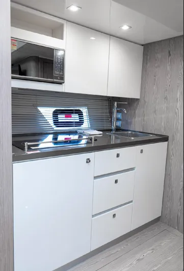  Yacht Photos Pics Modern kitchen interior of 2024 Sessa Marine C44 Cruiser yacht.