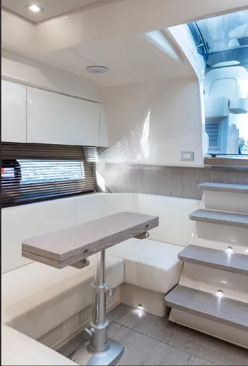  Yacht Photos Pics Luxurious interior of 2024 Sessa Marine C44 Cruiser with modern seating and elegant staircase.