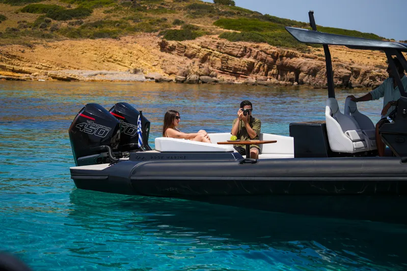 Rock Marine Rm 36 U | 36 S Yacht Photos Pics 2026 Rock Marine RM 36 boat on clear water, people relaxing and taking photos.