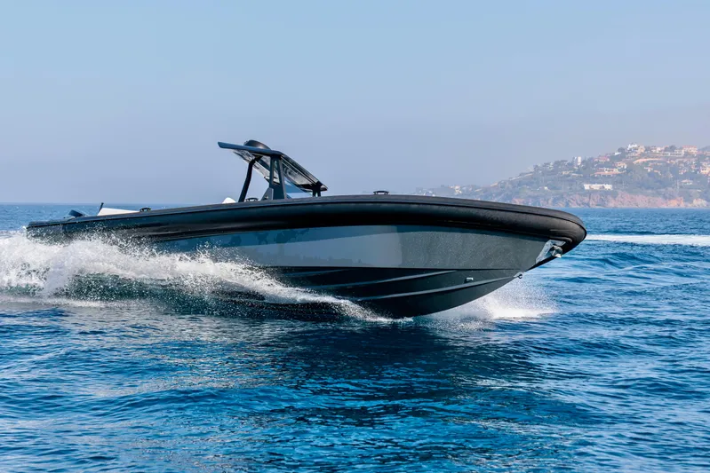 Rock Marine Rm 36 U | 36 S Yacht Photos Pics 2026 Rock Marine RM 36 boat cruising on open water, coastal background.