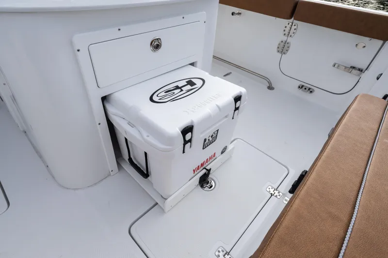  Yacht Photos Pics 2026 Sea Hunt Ultra 285 SE boat interior with cooler storage.