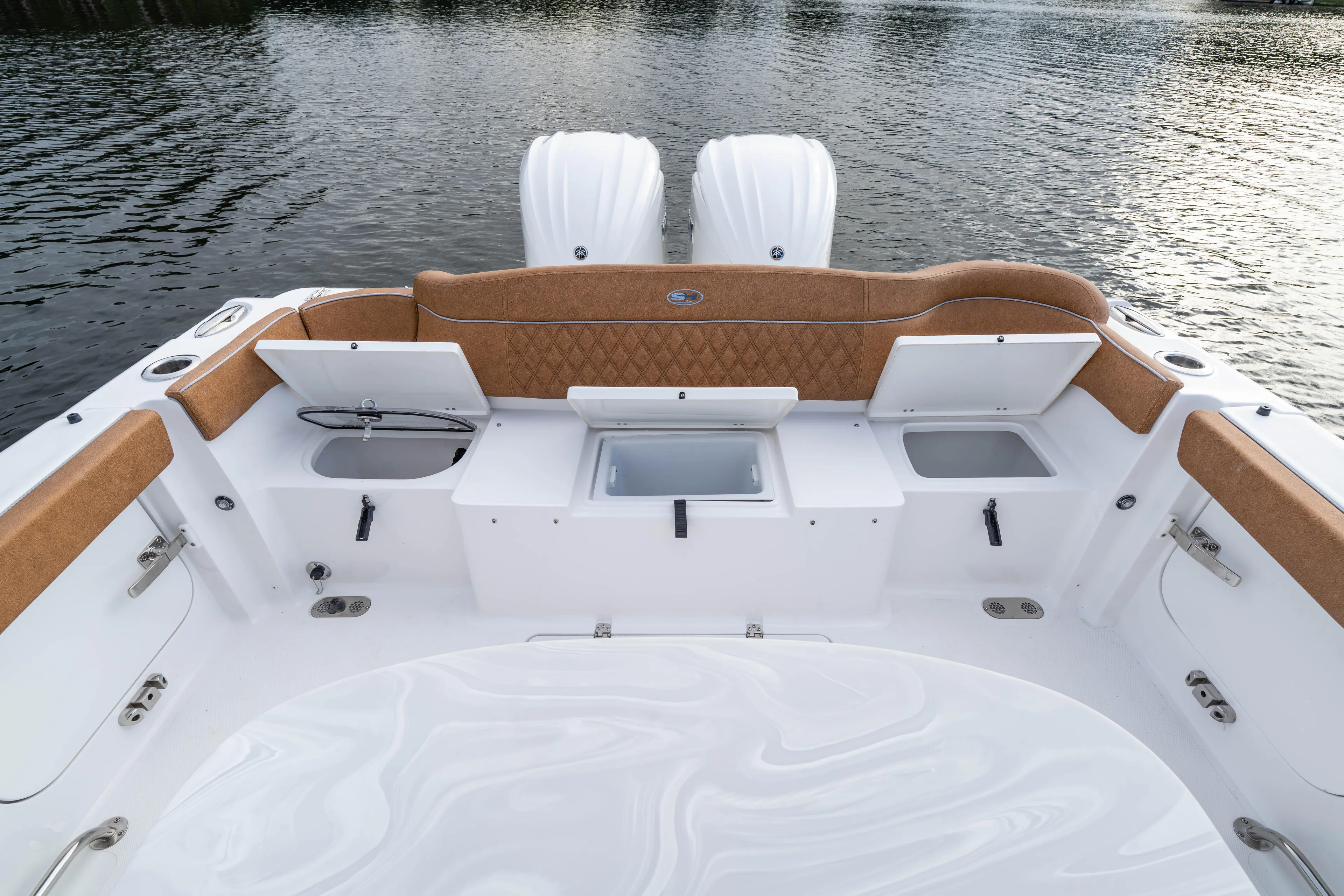  Yacht Photos Pics 2026 Sea Hunt Ultra 285 SE boat interior with storage compartments and twin engines.